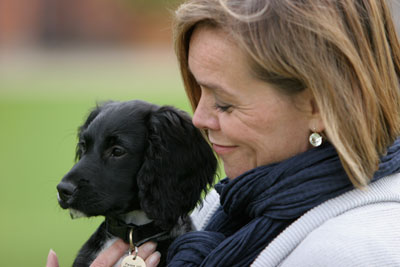 Jan cradling Dog